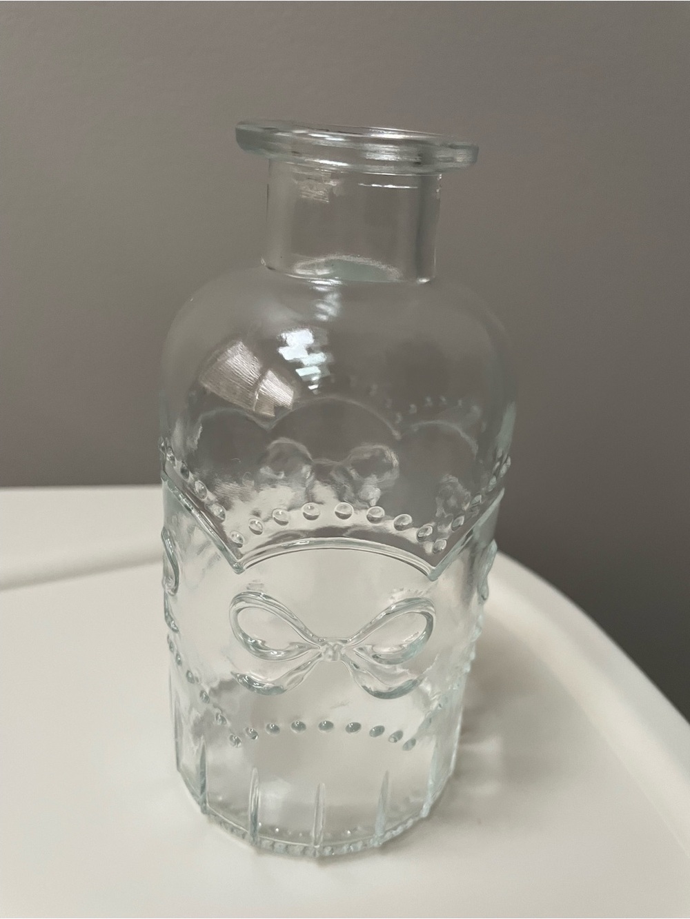 Decorative Clear Vase with Embossed Bow Accent
